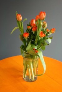 orange tulips in a vase